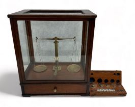 Set of Gertling Chemists Balance Scales in glazed Mahogany cabinet together with a boxed set of