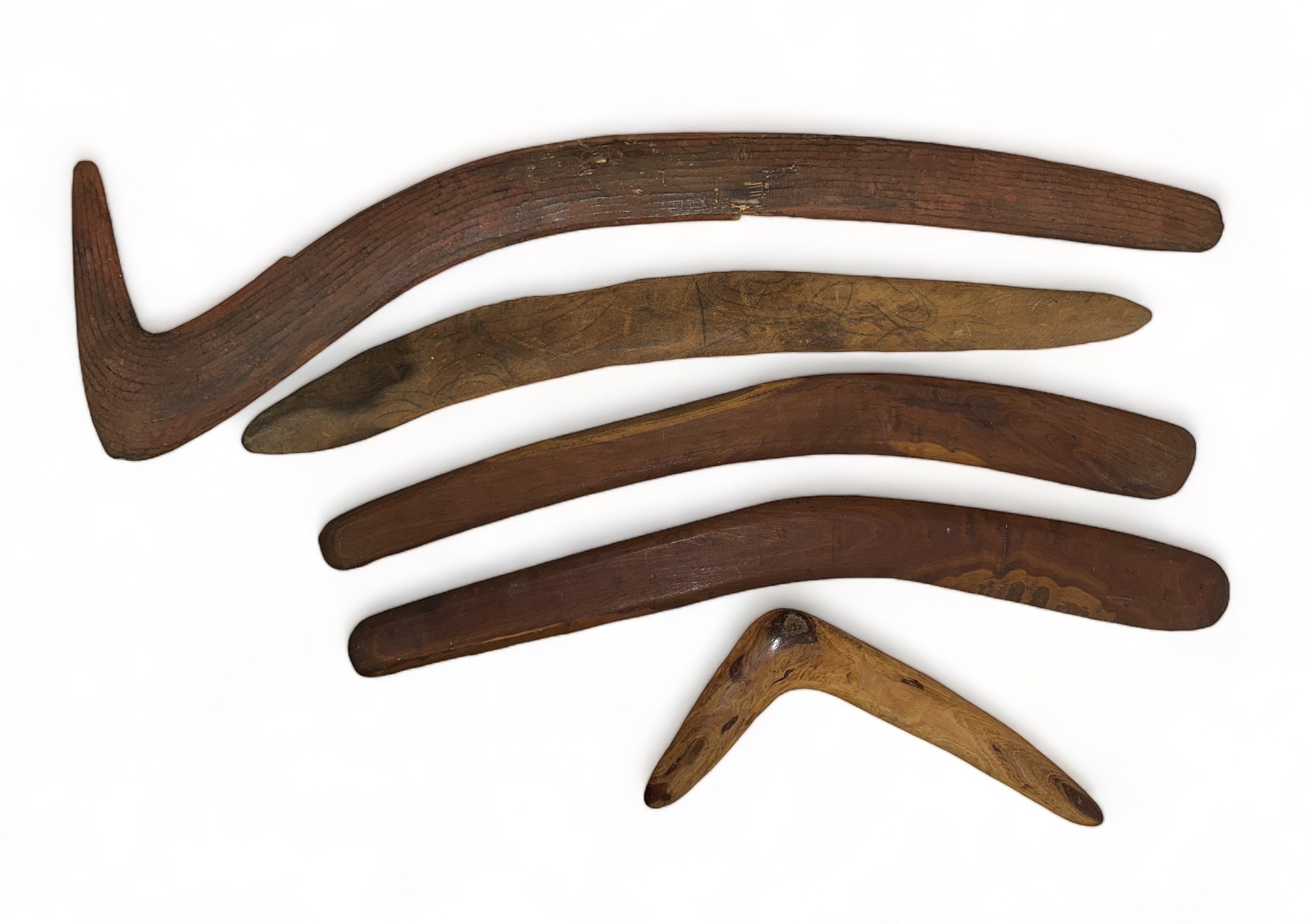 Aboriginal Boomerangs. 5 in total one large hunting boomerang 75cm x 20cm with unusual striated