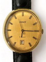 A Tissot stylist gold plated mechanical wristwatch. Oval champage dial with baton hour markers and