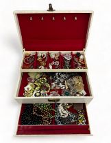 Jewellery box containing a quantity of costume jewellery.