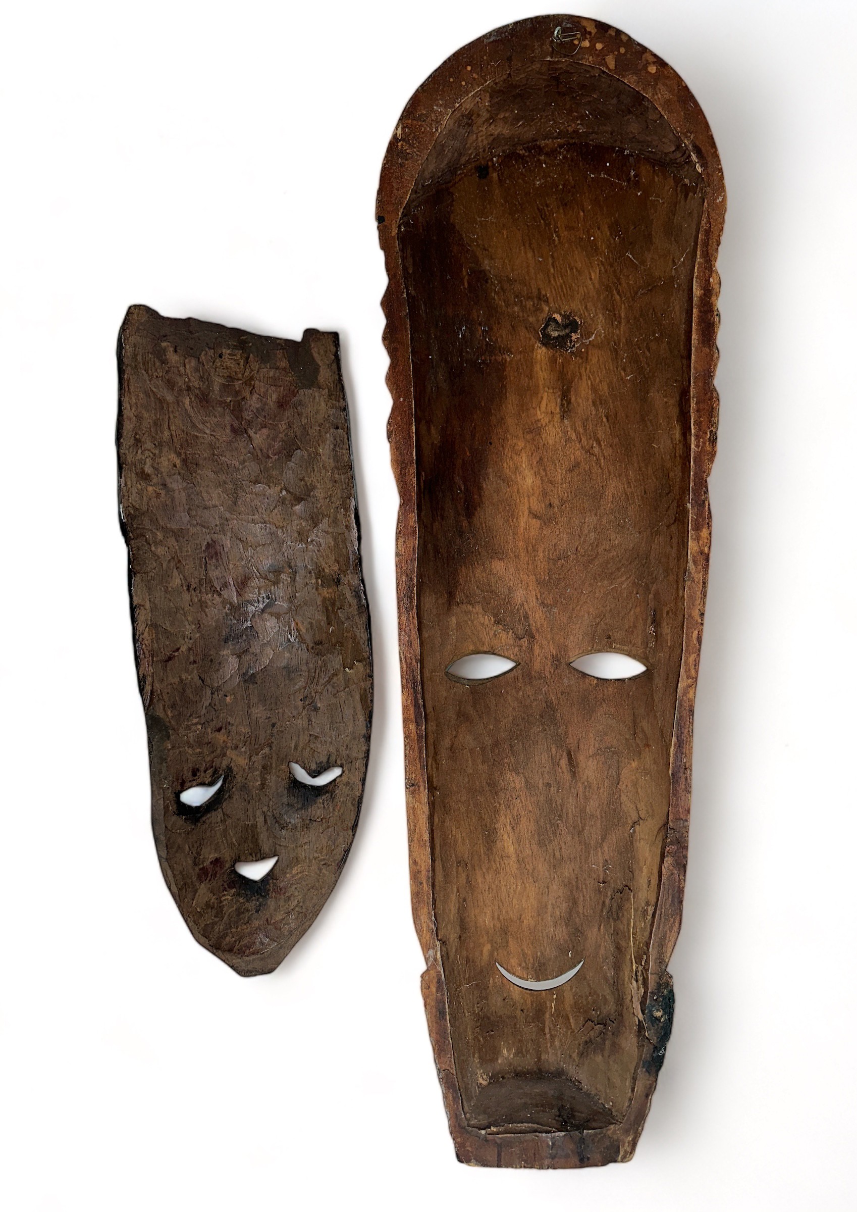 Pair of decorative wooden tribal masks, two designs, one larger and hand painted. Heights 75cm & - Image 2 of 2