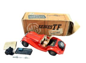 Victory Models 1/18th scale battery-operated plastic MG TF - red body, tan seats, cream dashboard