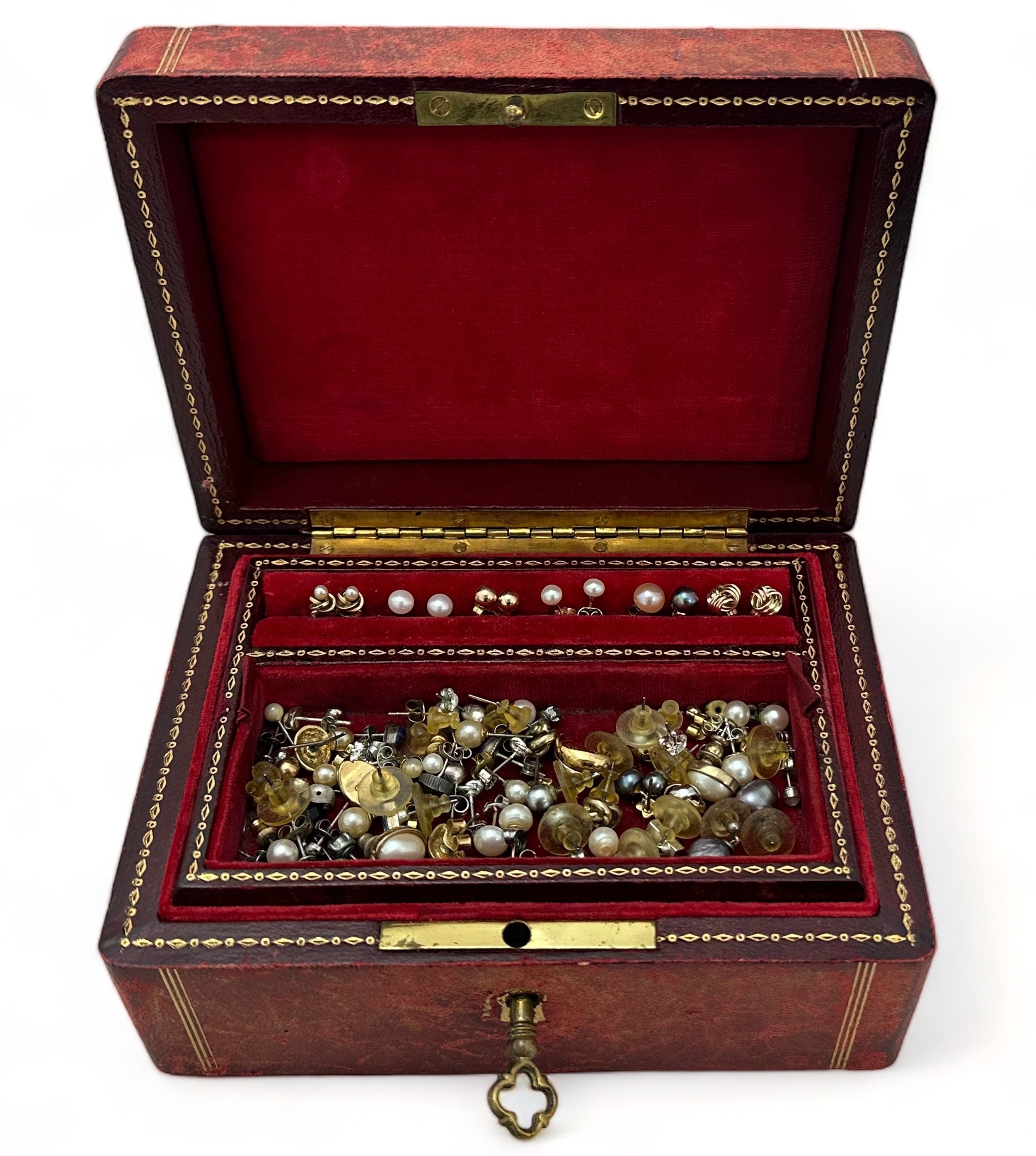 A jewellery box containing a range of earrings, mostly in pairs, several set with pearls etc, some