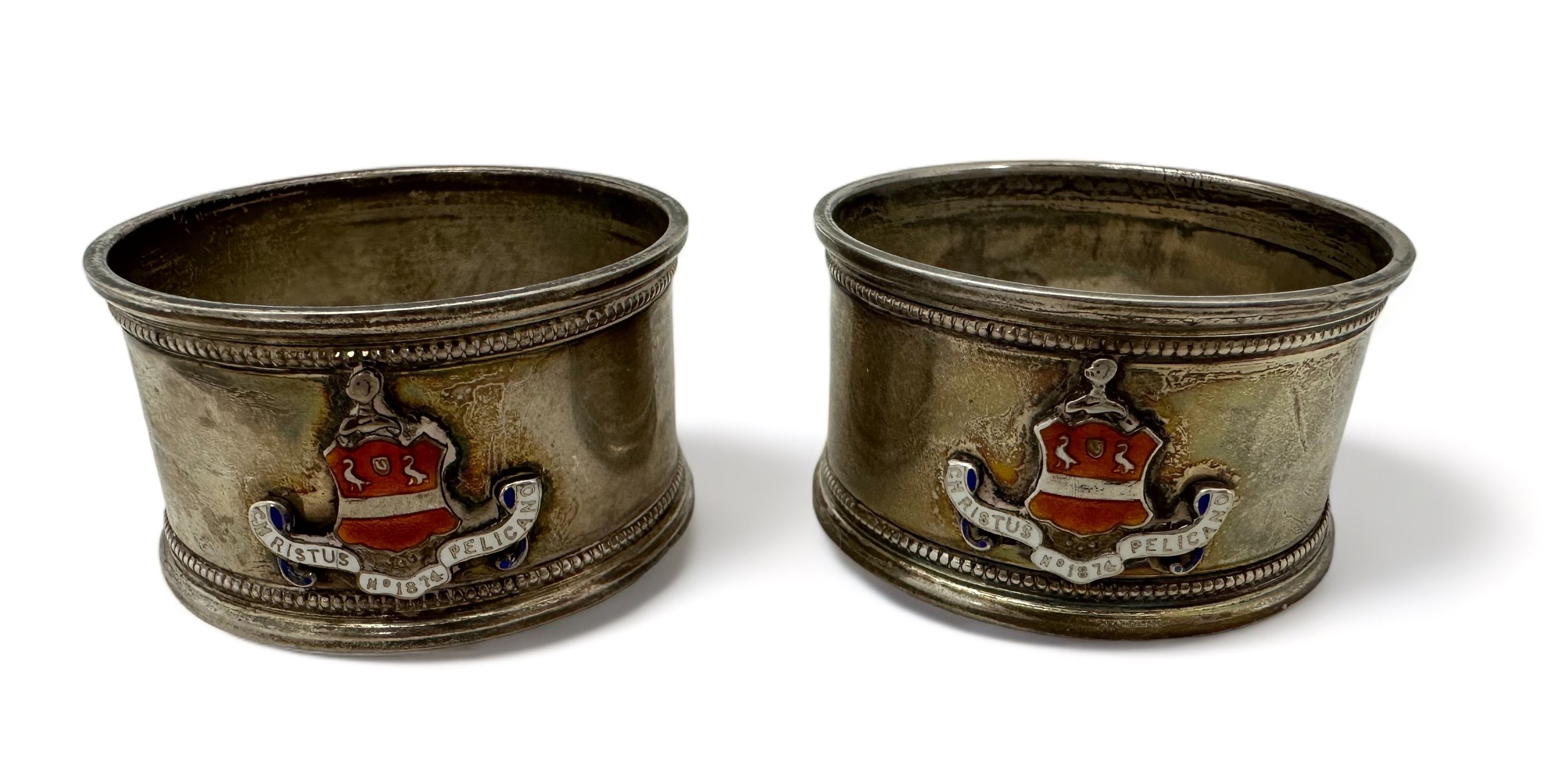 A pair of silver napkin rings with the crest and motto 'Christus Pelicano' for Lechmere Volunteer