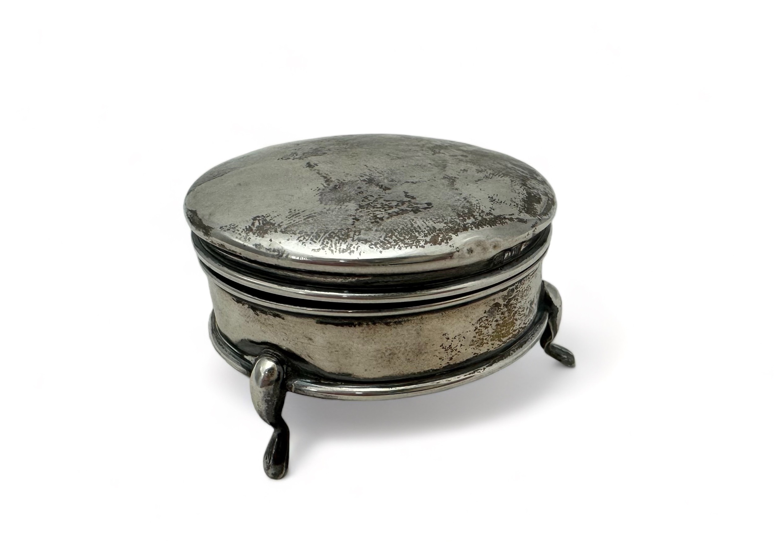 A silver circular hinged trinket box, fabric lined and on three legs. Condition: dents to lid, - Image 2 of 3
