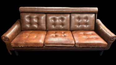 Scandinavian mid-century brown leather-style sofa, wooden frame with four wooden legs. Reversible