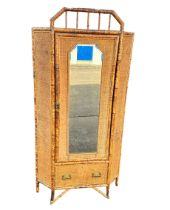 A Victorian bamboo and raffia corner wardrobe. 70 x 70 x 190cm.