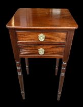 A 2 drawer mahogany side table on turned legs. W40cm, d37cm, h74cm.