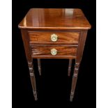 A 2 drawer mahogany side table on turned legs. W40cm, d37cm, h74cm.