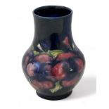 Moorcroft baluster shaped vase in the pansy pattern - impressed to base M74. 16.5cm high. Some