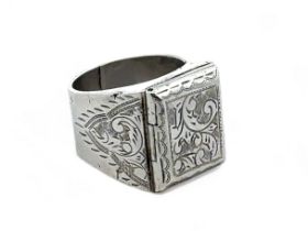 An engraved silver poison ring with import hallmarks, size P. Weight 12.4g.