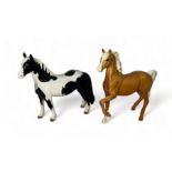 Beswick, pair of figures to include; Beswick Piebald Pinto Pony and Beswick Palomino trotting horse.