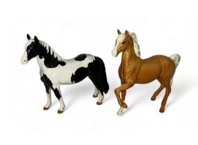 Beswick, pair of figures to include; Beswick Piebald Pinto Pony and Beswick Palomino trotting horse.