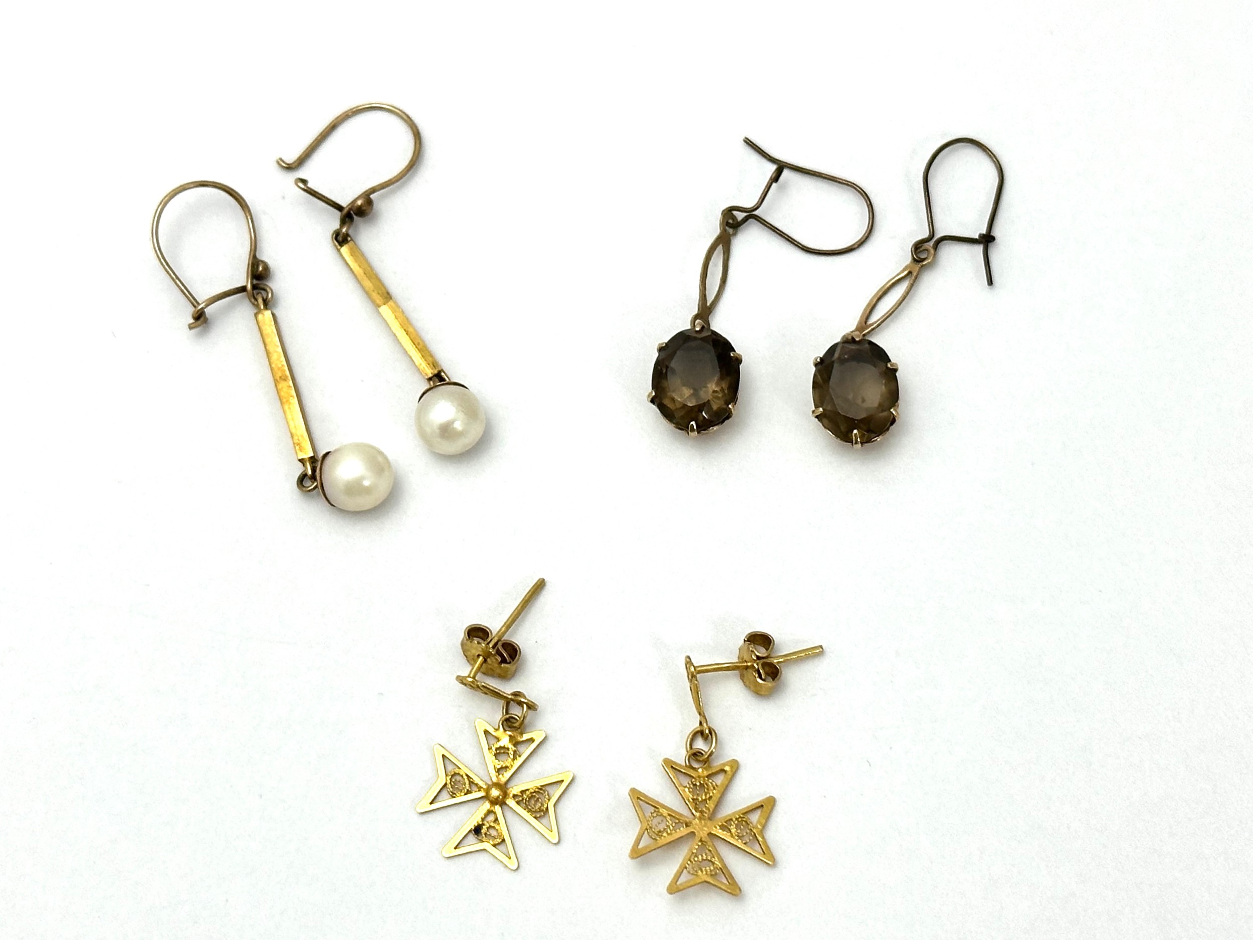 Three pairs of earrings, a pair of 9ct gold and smoky quartz earrings, a pair of 18ct gold Maltese