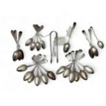 Silver tea spoons, table spoons and sugar tongs. Includes a set of twelve dessert spoons by