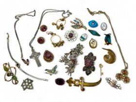 A collection of silver and costume jewellery including a white metal and silver charm bracelet, a