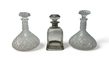 Trio of glass decanters, including pair with glass stoppers and a Brescia Peltro Crystal 95% fine