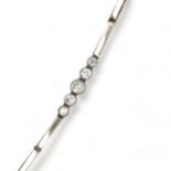 A five stone diamond bracelet, the links being tested using XRF as 14ct gold over platinum.