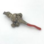 A silver and coral teething rattle and whistle. Hallmarks for Birmingham but date unclear,