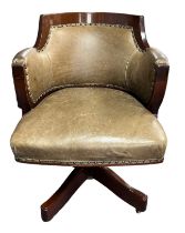 A mahogany swivel and tilt desk chair.