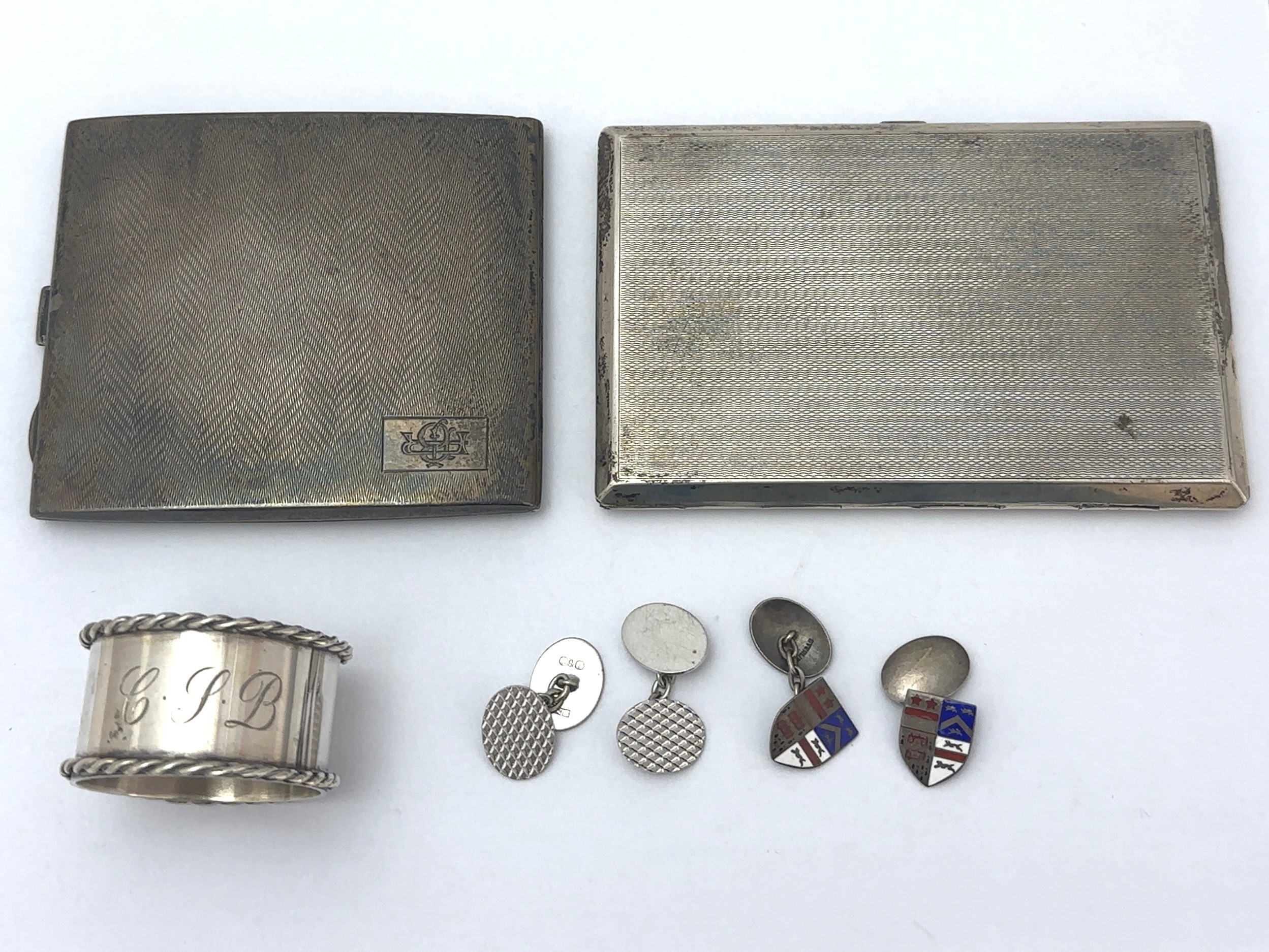 Silver items. Includes- a rectangular cigarette case stamped silver with inscription to inner