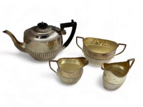 Four demi fluted tea service items. Includes a George III cream jug, marked AB, London 1799, a