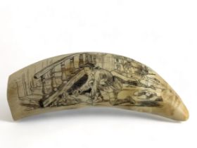 An American themed whale tooth scrimshaw depicting a man lighting a fire under a staircase whilst