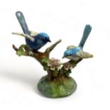A Staffordshire porcelain figure of two blue birds, designed and modelled by J.T.Jones. Approx