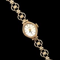 A ladies 9ct gold Everite quartz cocktail watch on a 9ct gold fancy link bracelet.