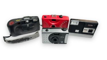 Four film cameras. A Vivitar PN 919 Panoramic camera with 28mm lens. Halina Disc 138, f2.8 12.5mm