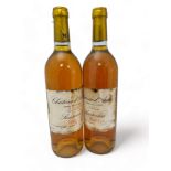 Two bottles of Chateau d’Arche Sauternes 1988, Grand Cru Classe. Damage to labels.