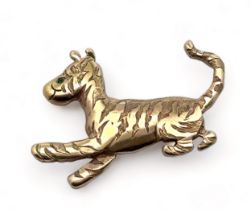 A hallmarked 9ct Tigger brooch with emerald eye. Made bespoke for the vendor by Peter Trigg.