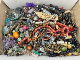 A box of hardstone and costume jewellery.