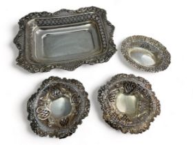 Four late Victorian repousse silver items. Includes a silver tray with marks for William Comyns &