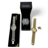 Three watches. A gents quartz wrist watch with seconds sweep and date aperture on gilt mesh strap