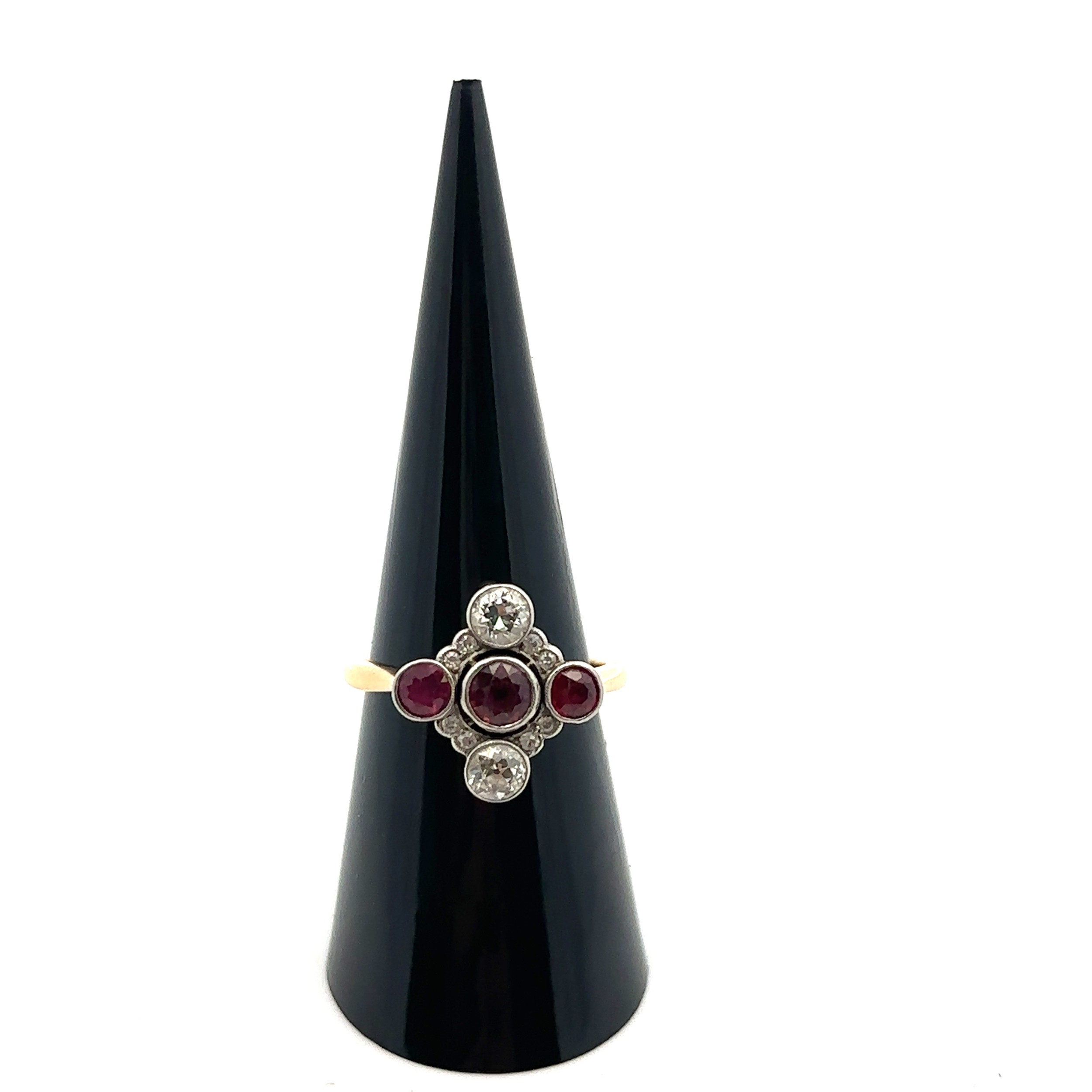 A ruby and diamond quatrefoil ring, size N, stamped 18ct. Two old cut diamonds each approx 0.3ct, - Bild 2 aus 2