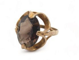 A hallmarked 9ct gold smoky quartz ring, size N. Smoky quartz 16mm x 12mm, estimated 6.7ct. Weight