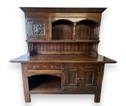 Liberty & Co, an Edwardian Arts and Crafts oak 'Lochleven' sideboard by Liberty & Co, the shelf back