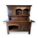 Liberty & Co, an Edwardian Arts and Crafts oak 'Lochleven' sideboard by Liberty & Co, the shelf back