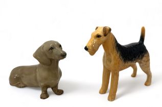 Two ceramic dogs - a Beswick Airedale terrier , stamped 'C.H. Cast Iron Monarch,' and a Studio