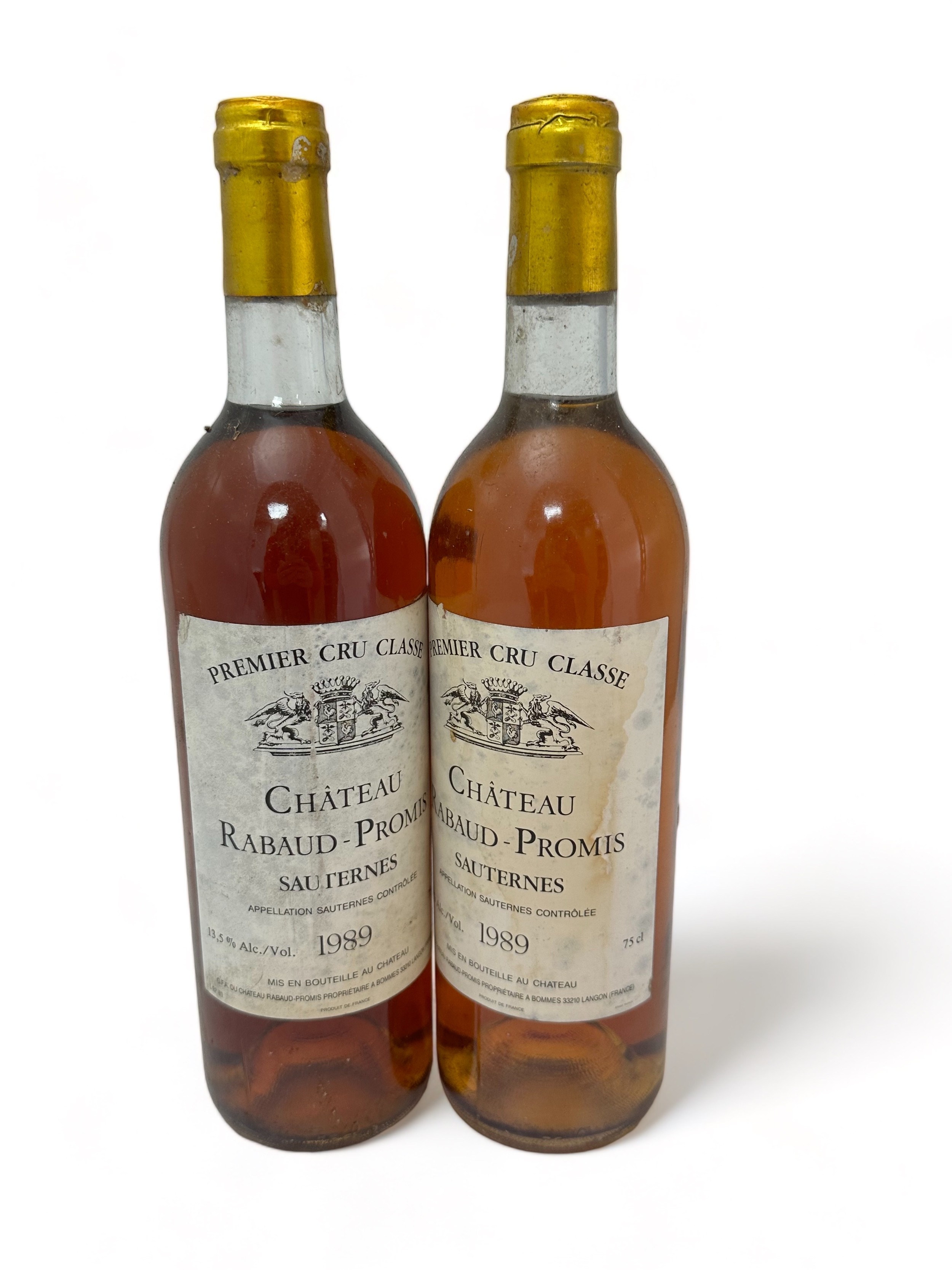 Two bottles of dessert wine Chateau Rabaud-Promis Sauternes 1989, Premier Cru Classé. Some damage to