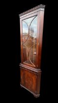 A Bridgecraft Mahogany Corner Cabinet with glazed door and two internal glazed shelves over lower