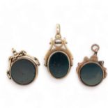 Three bloodstone / carnelian swivel fobs. Two hallmarked 9ct gold, one unmarked but tests as 9ct