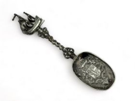 A repousse silver spoon with a sailing ship terminal. Inscribed on reverse 'C.A.S & H.C.N Sep 9th