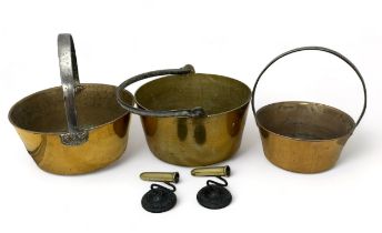 A set of three graduated brass jam pans with handles (diameters 30cm, 29.5cm, 22cm) offered together