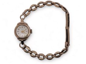 Cudax ladies 9ct gold 17 jewel cocktail watch on a hallmarked 9ct gold bracelet. Silvered dial