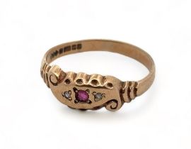 A 9ct yellow gold gypsy ring with scroll design and scalloped shoulders, set with two small diamonds