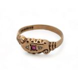 A 9ct yellow gold gypsy ring with scroll design and scalloped shoulders, set with two small diamonds