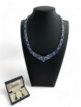 A lapis lazuli necklace stamped 960 (Argentium silver) together with a matching pair of earrings,