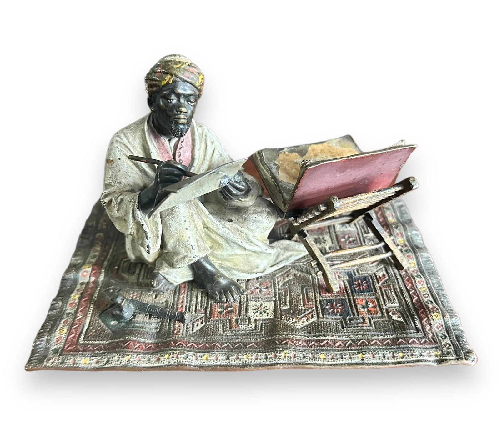 Franz Bergman (Austrian, 1861-1936), late 19th century, cast as an Arab scribe seated on a carpet,